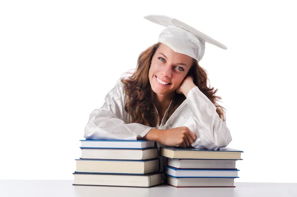 Glad examen med massor av böcker på vit — Stockfoto