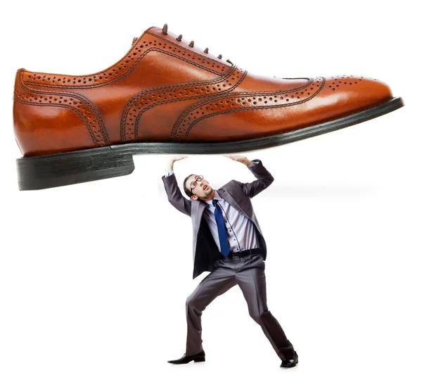 Woman domination concept with shoes and man Royalty Free Stock Photos