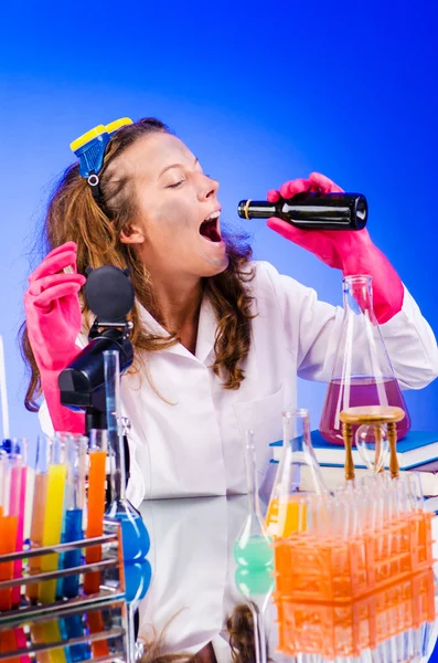 Funny female chemist in lab — Stock Photo, Image