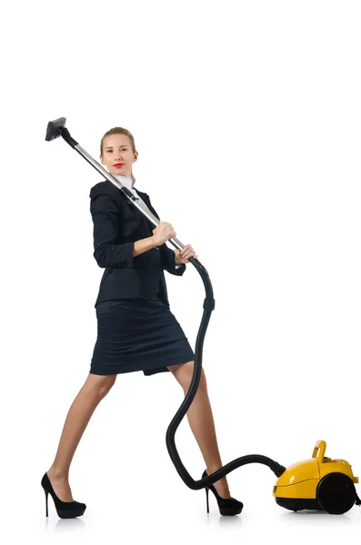 Businesswoman doing vacuum cleaning on white — Stock Photo, Image