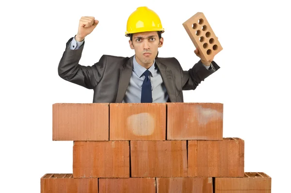 Businessman with bricks on white Royalty Free Stock Images