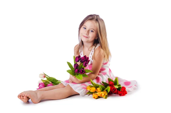 Cute little girl with flowers on white — Stock Photo, Image