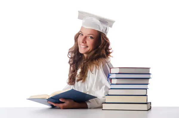 Šťastný absolvent se spoustou knih na bílém pozadí — Stock fotografie