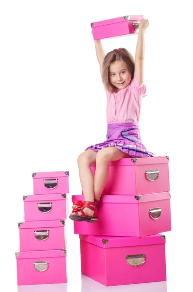 Niña linda con un montón de cajas —  Fotos de Stock