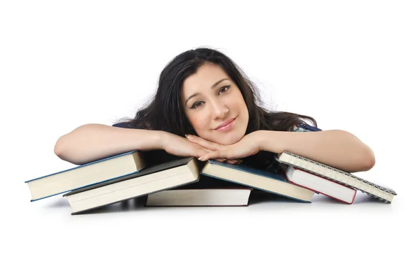 Estudante cansado com livros didáticos sobre branco — Fotografia de Stock