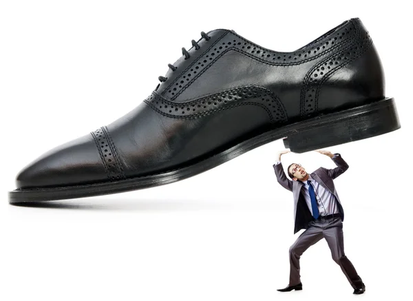 Woman domination concept with shoes and man Stock Photo