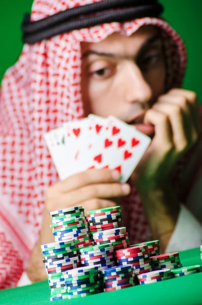 Arab playing in casino - gambling concept with man — Stock Photo, Image