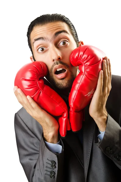 Uomo d'affari con guanti da boxe su bianco — Foto Stock