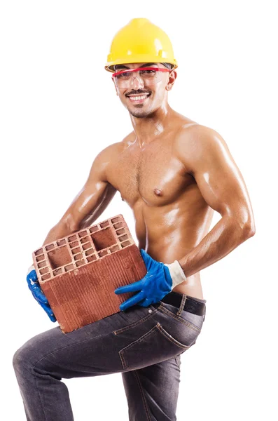 Construtor muscular com tijolos em branco — Fotografia de Stock