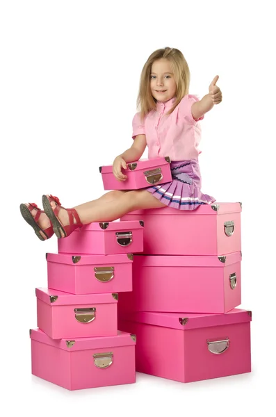 Little cute girl with lots of boxes — Stock Photo, Image