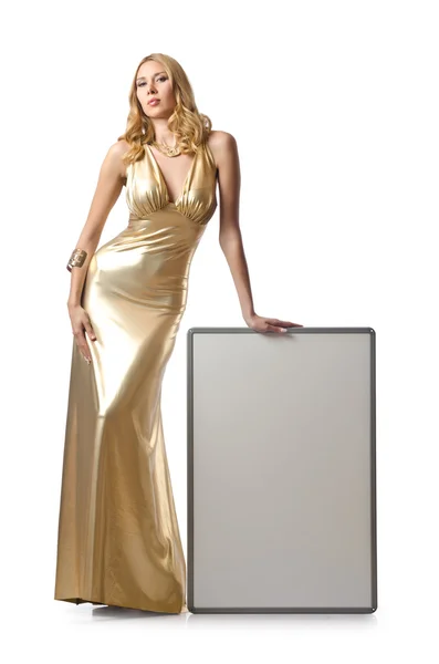 Vrouw in een gouden jurk met leeg bord — Stockfoto