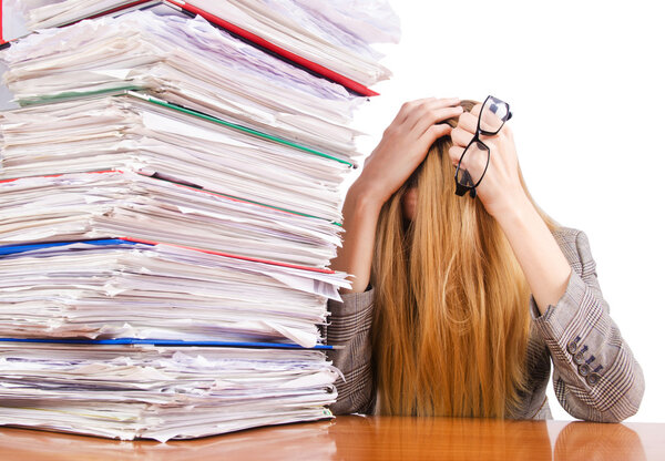Busy woman with stacks of paper