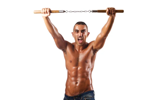 Man in martial arts concept with nunchucks — Stock Photo, Image