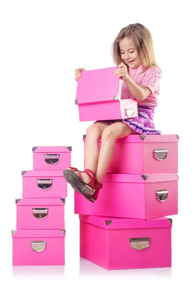 Little cute girl with lots of boxes — Stock Photo, Image