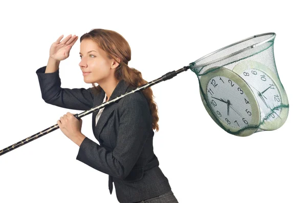 Businesswoman with net and clocks — Stock Photo, Image