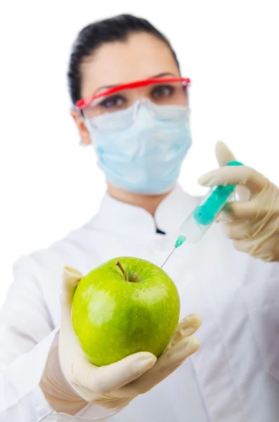 Chemical experiment with apple and syringe — Stock Photo, Image