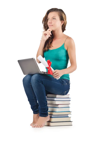 Student with netbook sitting on books — Stock Photo, Image