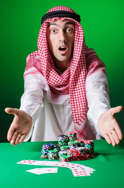 Arab playing in casino - gambling concept with man — Stock Photo, Image