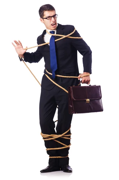 Empresário amarrado com corda no branco — Fotografia de Stock