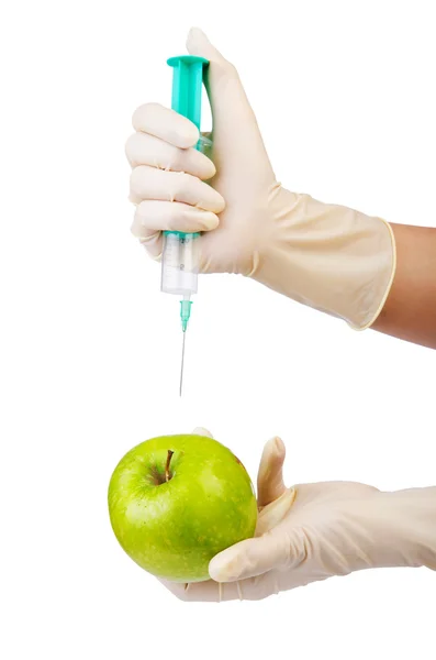 Chemical experiment with apple and syringe — Stock Photo, Image