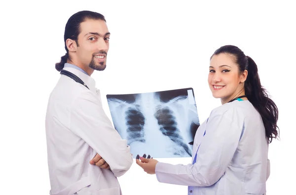 Two doctors looking at x-ray image on white — Stock Photo, Image