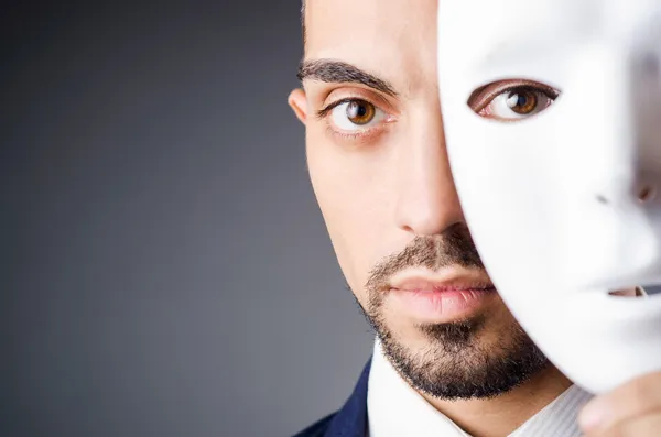 Man with black mask in studio — Stock Photo, Image