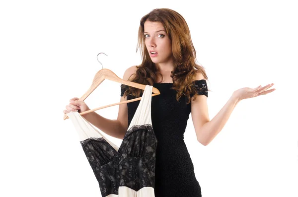 Jovem mulher tentando roupas novas em branco — Fotografia de Stock