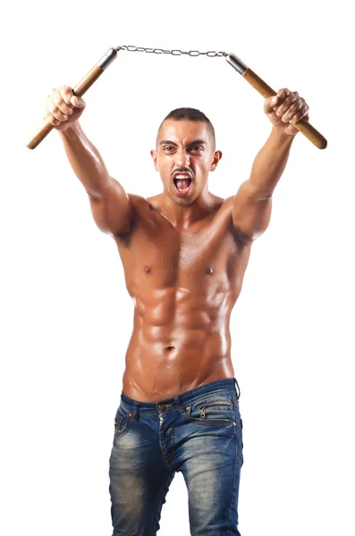 L'uomo nelle arti marziali concetto con nunchaku — Foto Stock