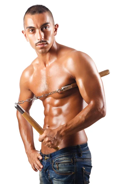 Hombre en el concepto de artes marciales con nunchucks — Foto de Stock