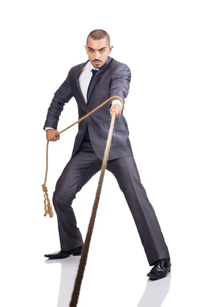 Man pulling the rope on white — Stock Photo, Image