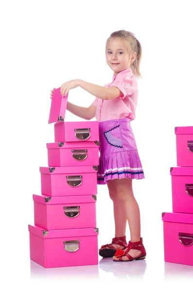 Niña linda con un montón de cajas —  Fotos de Stock