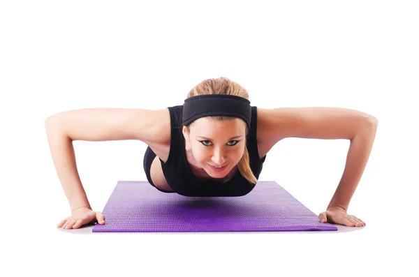 Jeune femme faisant des exercices sur blanc — Photo