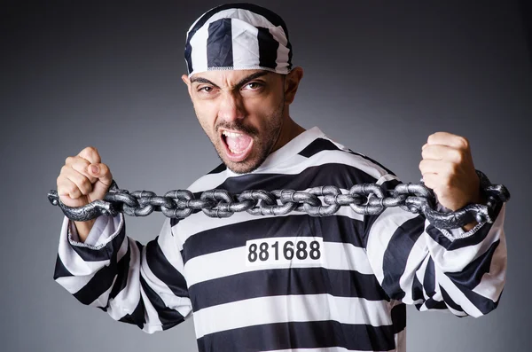 Convict criminal in striped uniform — Stock Photo, Image