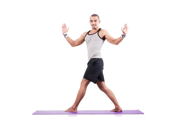 Hombre haciendo ejercicios en blanco — Foto de Stock