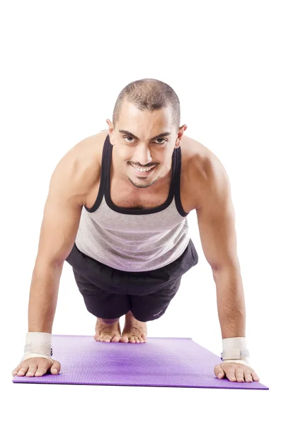 Hombre haciendo ejercicios en blanco — Foto de Stock