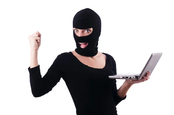 Hacker with computer wearing balaclava — Stock Photo, Image