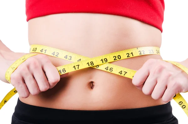 Молодая девушка с сантиметром в диете — стоковое фото