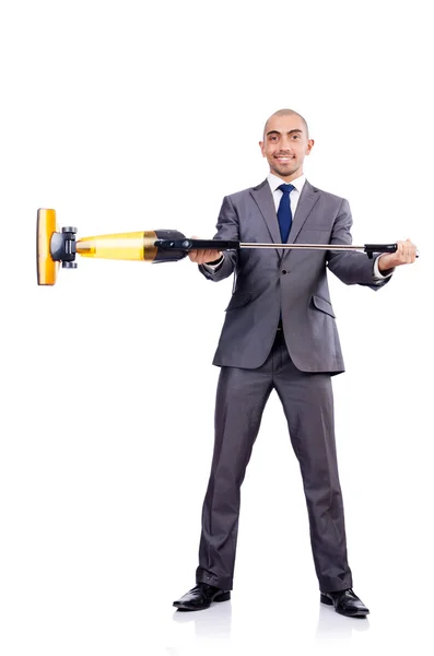 Businessman doing vacuum cleaning on white — Stock Photo, Image