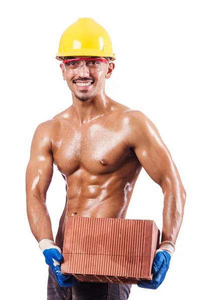 Muscular builder with bricks on white — Stock Photo, Image