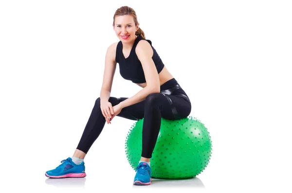 Chica joven con pelota suiza haciendo ejercicio —  Fotos de Stock