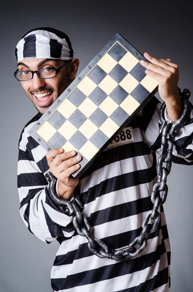 Convict criminal in striped uniform — Stock Photo, Image