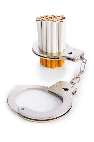 Addition concept with cigarettes and handcuffs — Stock Photo, Image