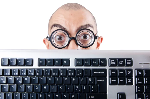 Nerd zakenman met toetsenbord van de computer op wit — Stockfoto