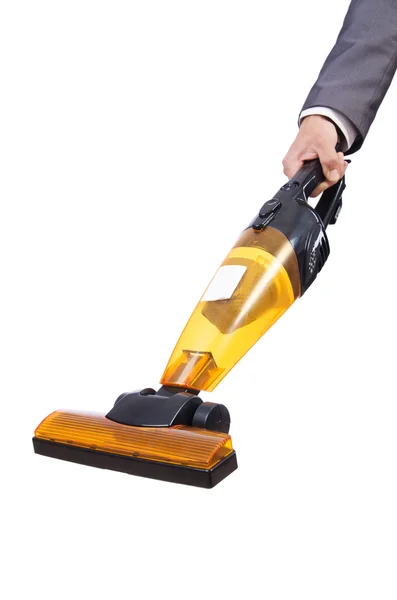 Businessman doing vacuum cleaning on white — Stock Photo, Image