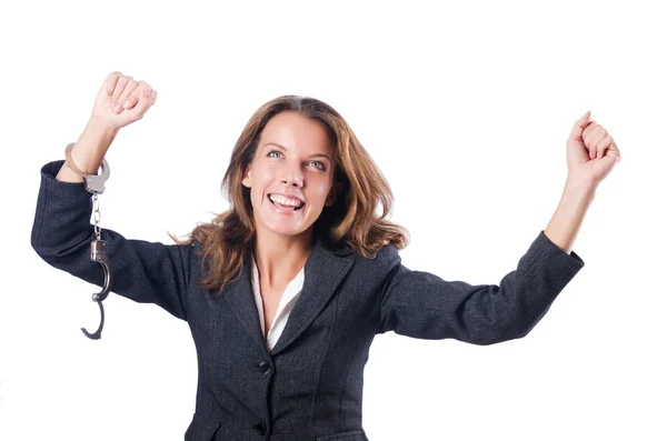 Female businesswoman with handcuffs on white — Stock Photo, Image