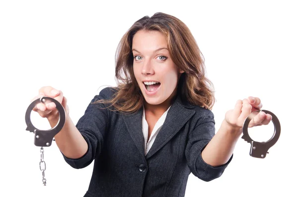 Female businesswoman with handcuffs on white — Stock Photo, Image