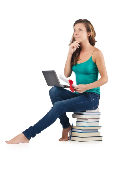 Student with netbook sitting on books — Stock Photo, Image