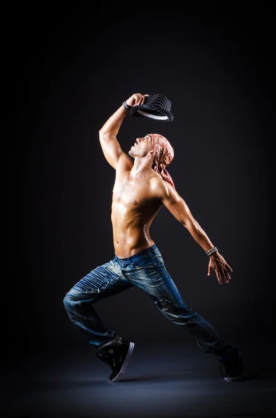 Dancer dancing in dark room — Stock Photo, Image