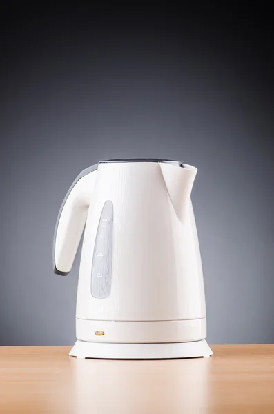 White kettle against grey background — Stock Photo, Image