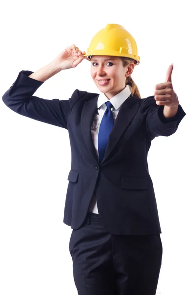 Young businesswoman with hard hat on white — Stock Photo, Image